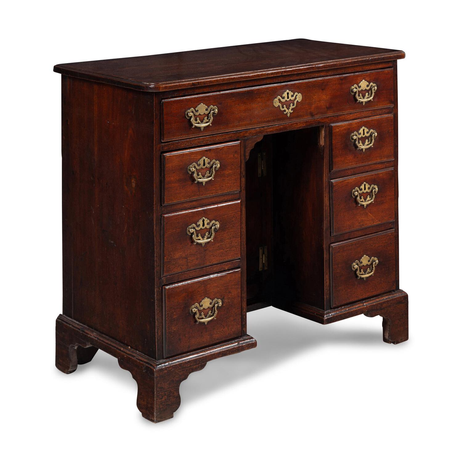 A George II Walnut Kneehole Desk