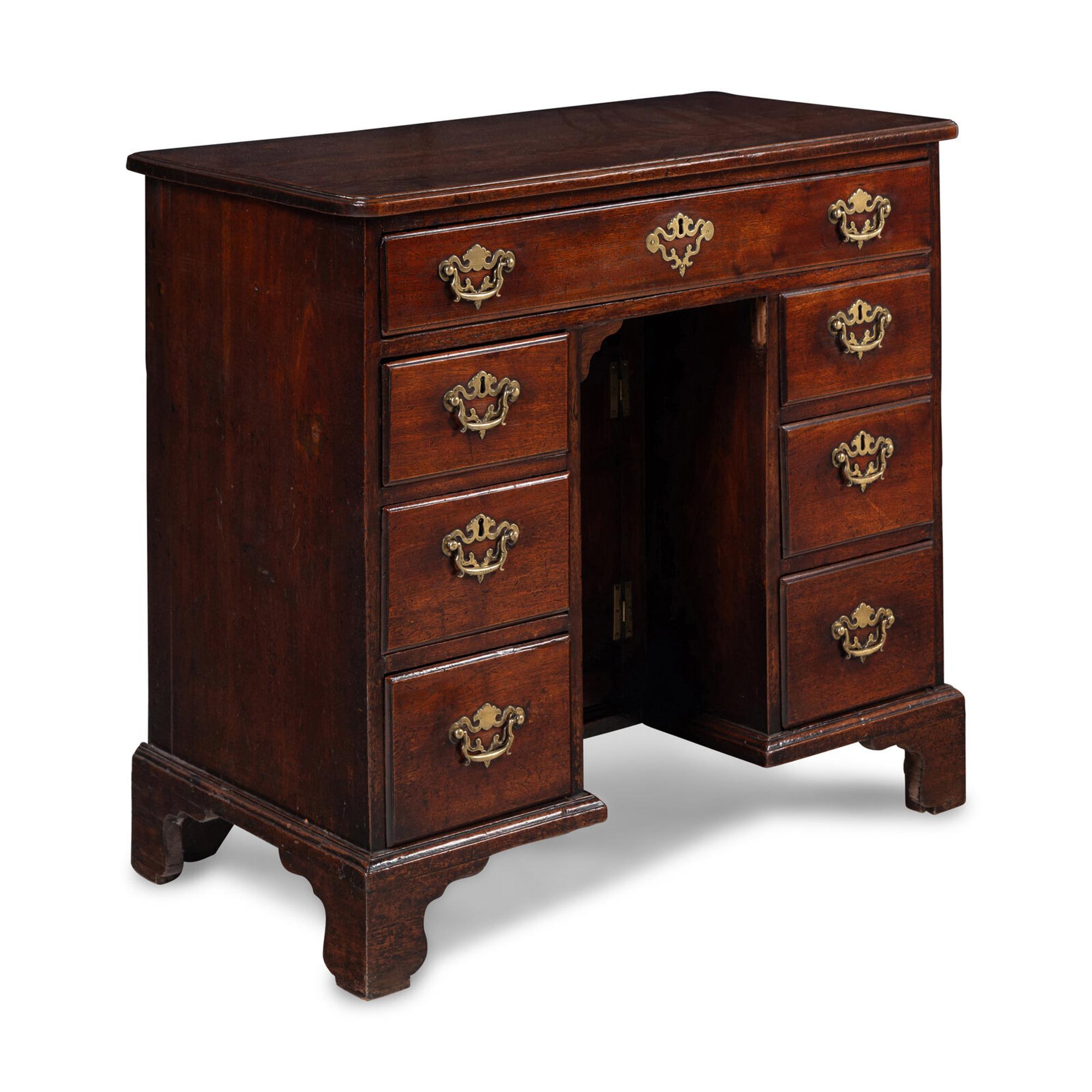 A George II Walnut Kneehole Desk