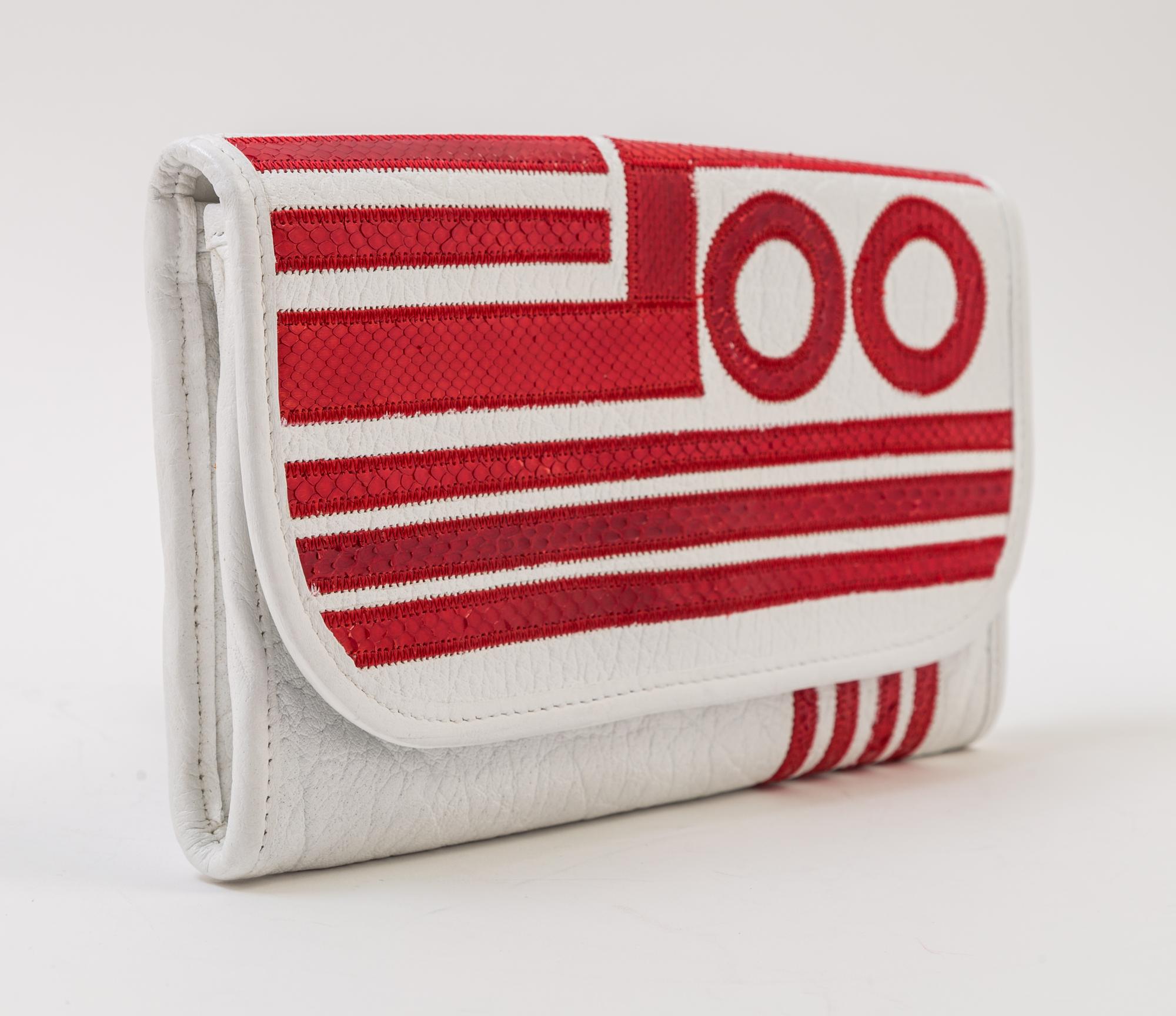 A Carlos Falchi White Leather Optical Clutch, 9" x 5.5" x .5".