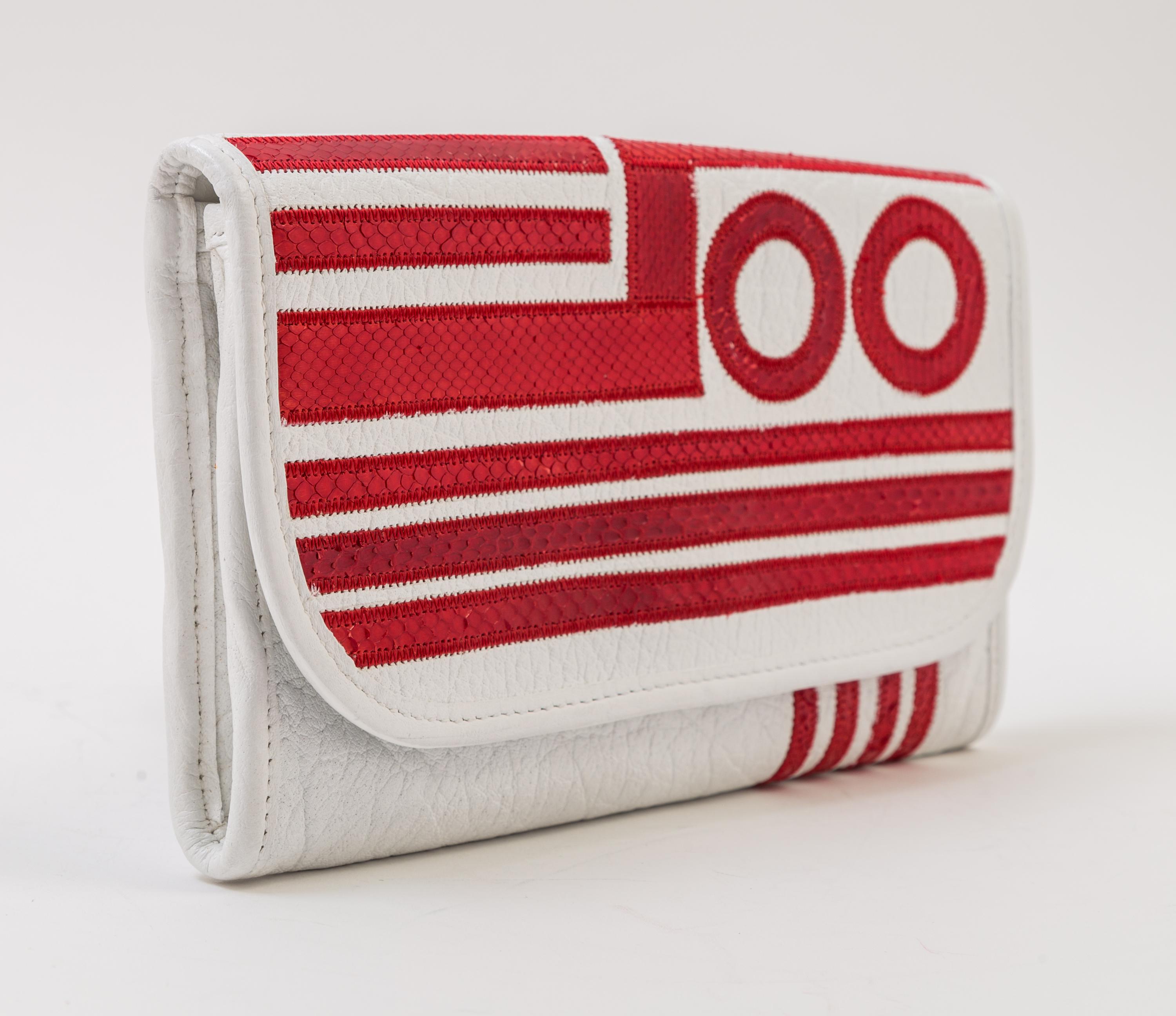 A Carlos Falchi White Leather Optical Clutch, 9" x 5.5" x .5".