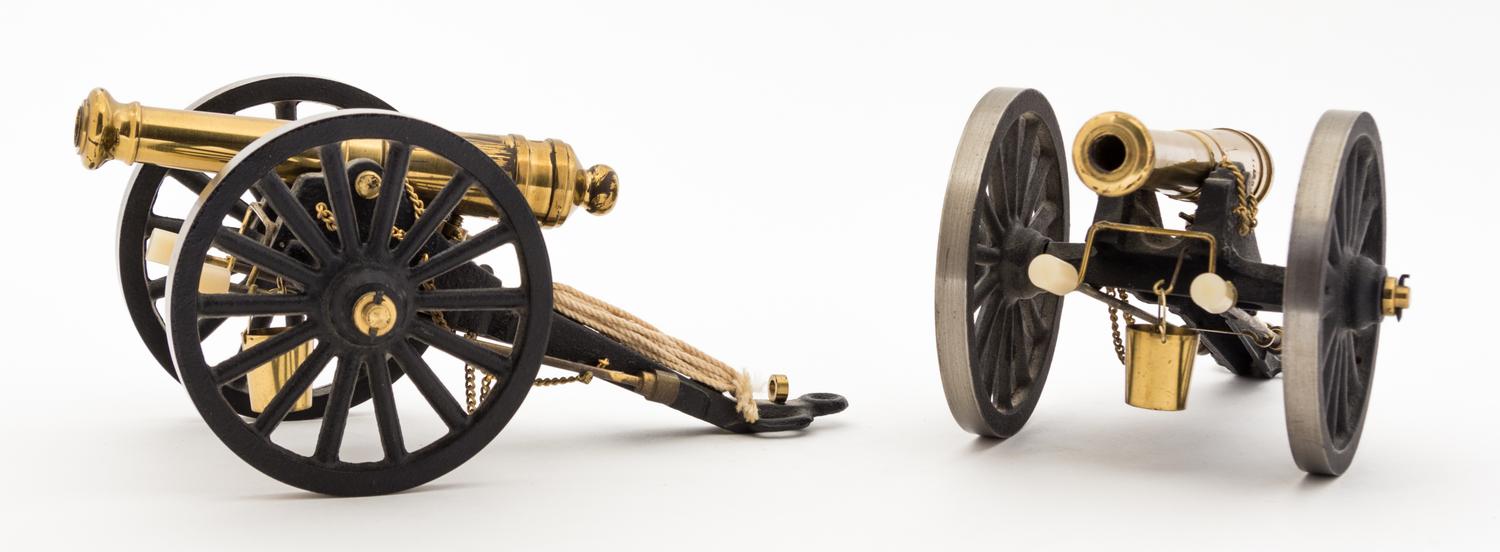Two Continental Brass Models of Cannons Length 7 7/8 inches.