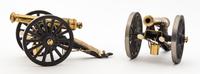 Two Continental Brass Models of Cannons Length 7 7/8 inches.