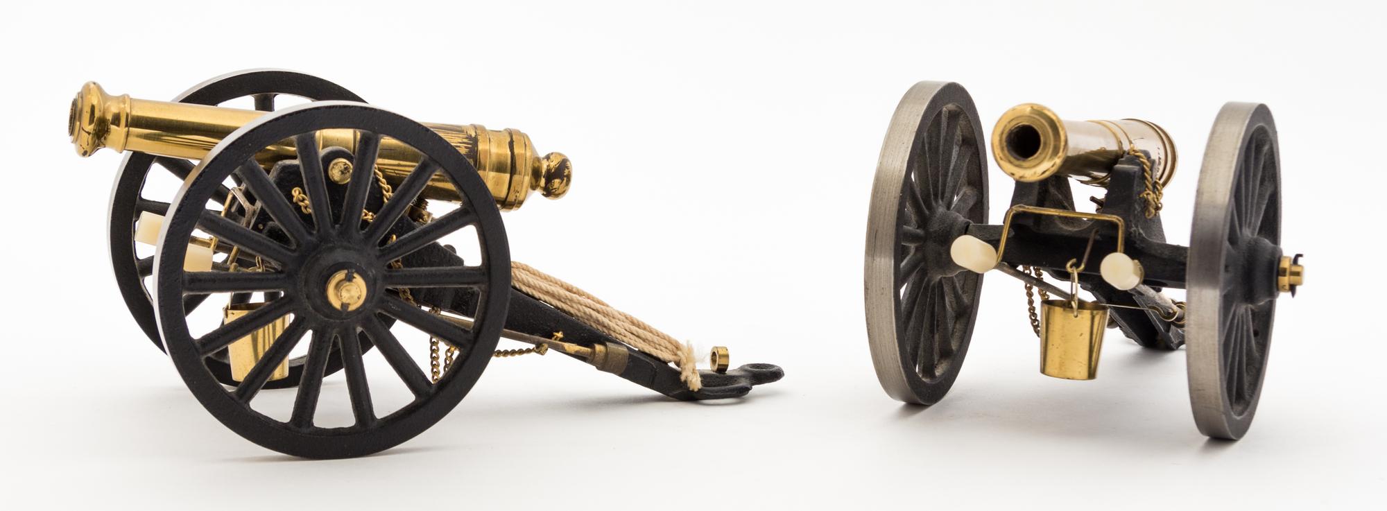 Two Continental Brass Models of Cannons Length 7 7/8 inches.
