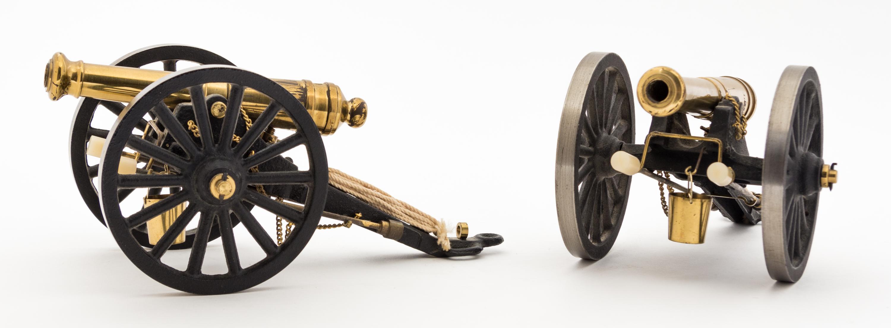 Two Continental Brass Models of Cannons Length 7 7/8 inches.