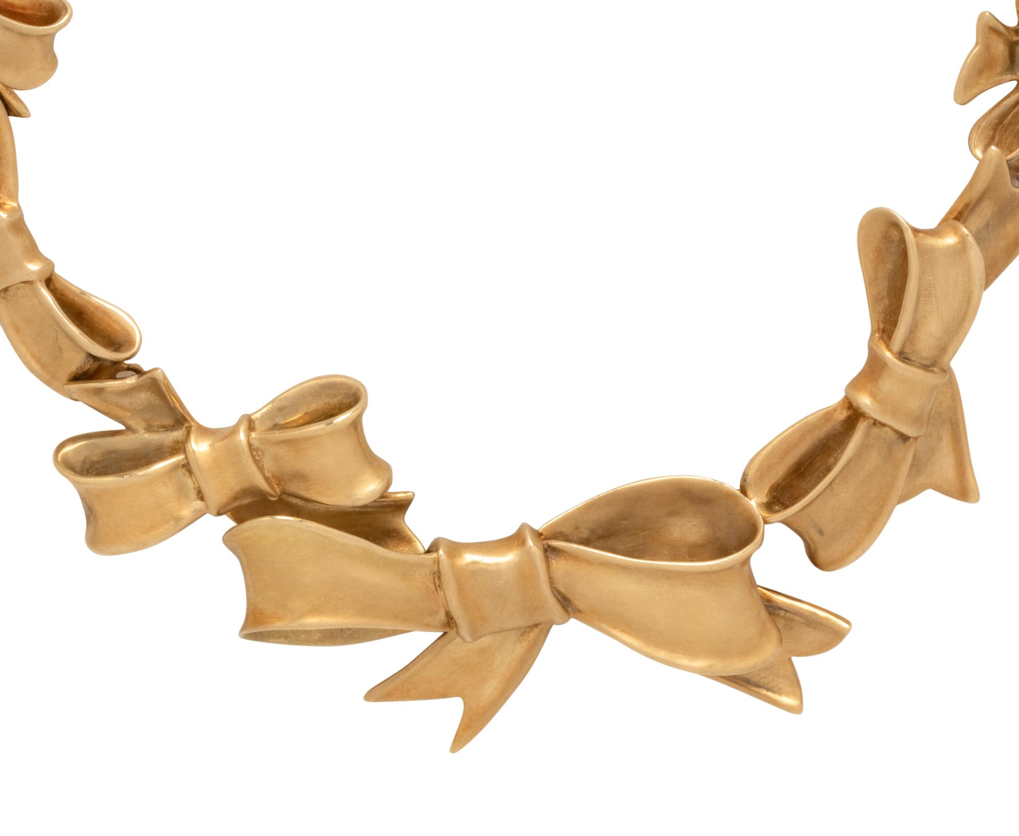 ANGELA CUMMINGS, YELLOW GOLD BOW NECKLACE