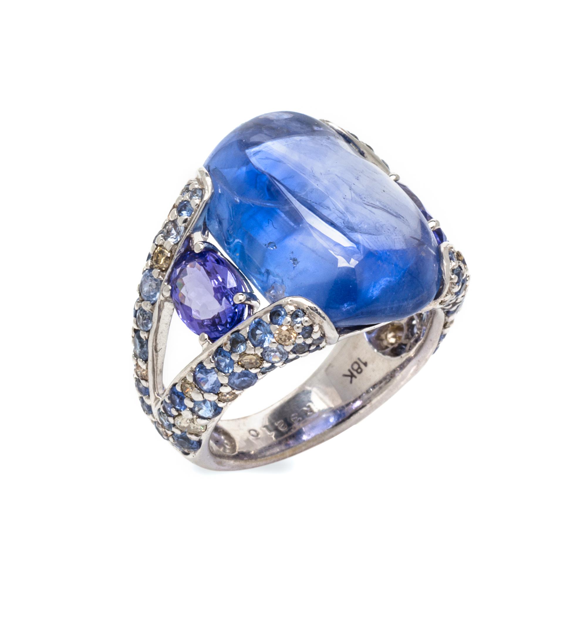 An 18 Karat White Gold, Sapphire, Tanzanite and Diamond Ring, 8.30 dwts.