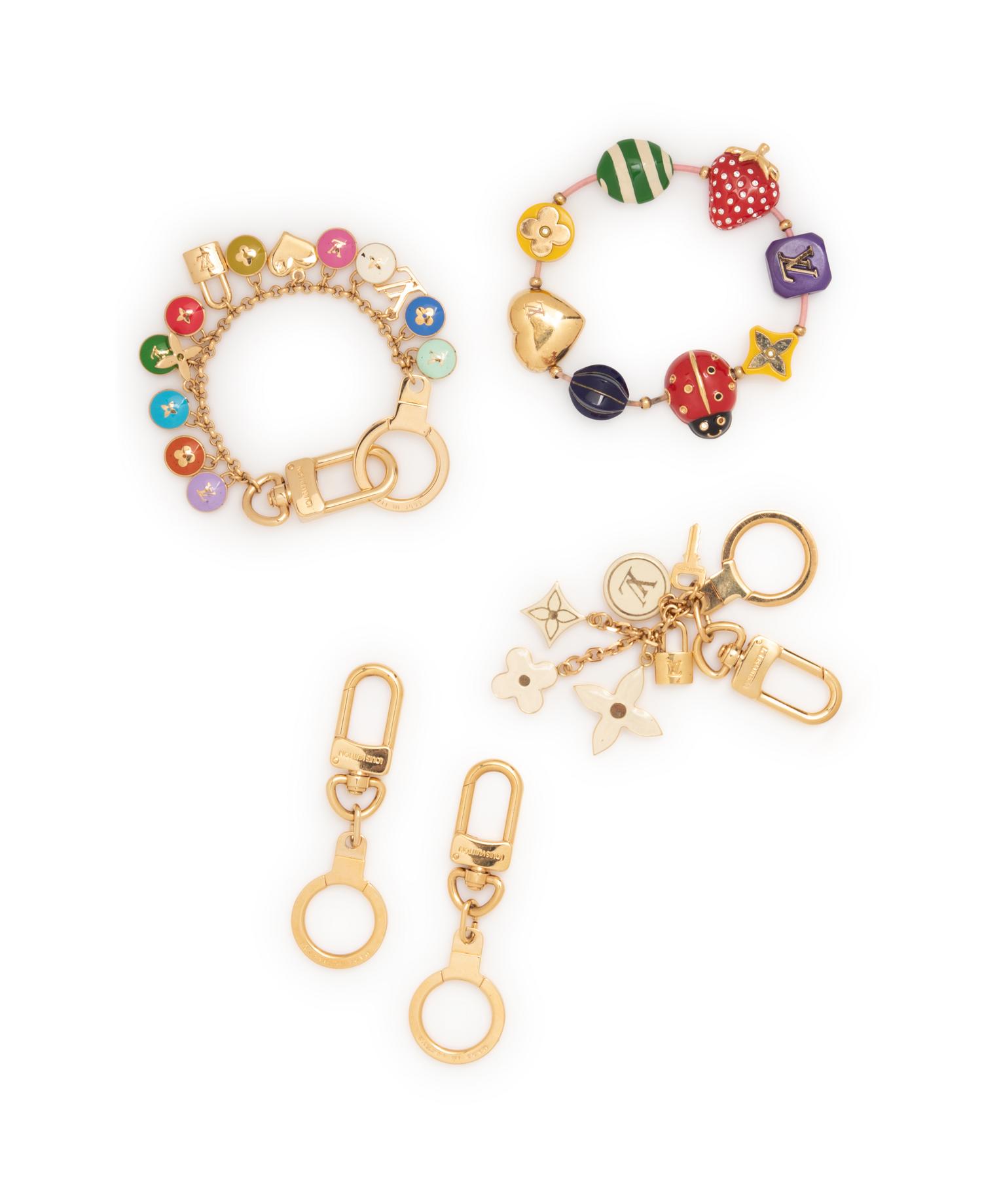 Five Louis Vuitton pieces, 2000-10s: One Bracelet & Four Purse/Key Chains