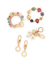 Five Louis Vuitton pieces, 2000-10s: One Bracelet & Four Purse/Key Chains