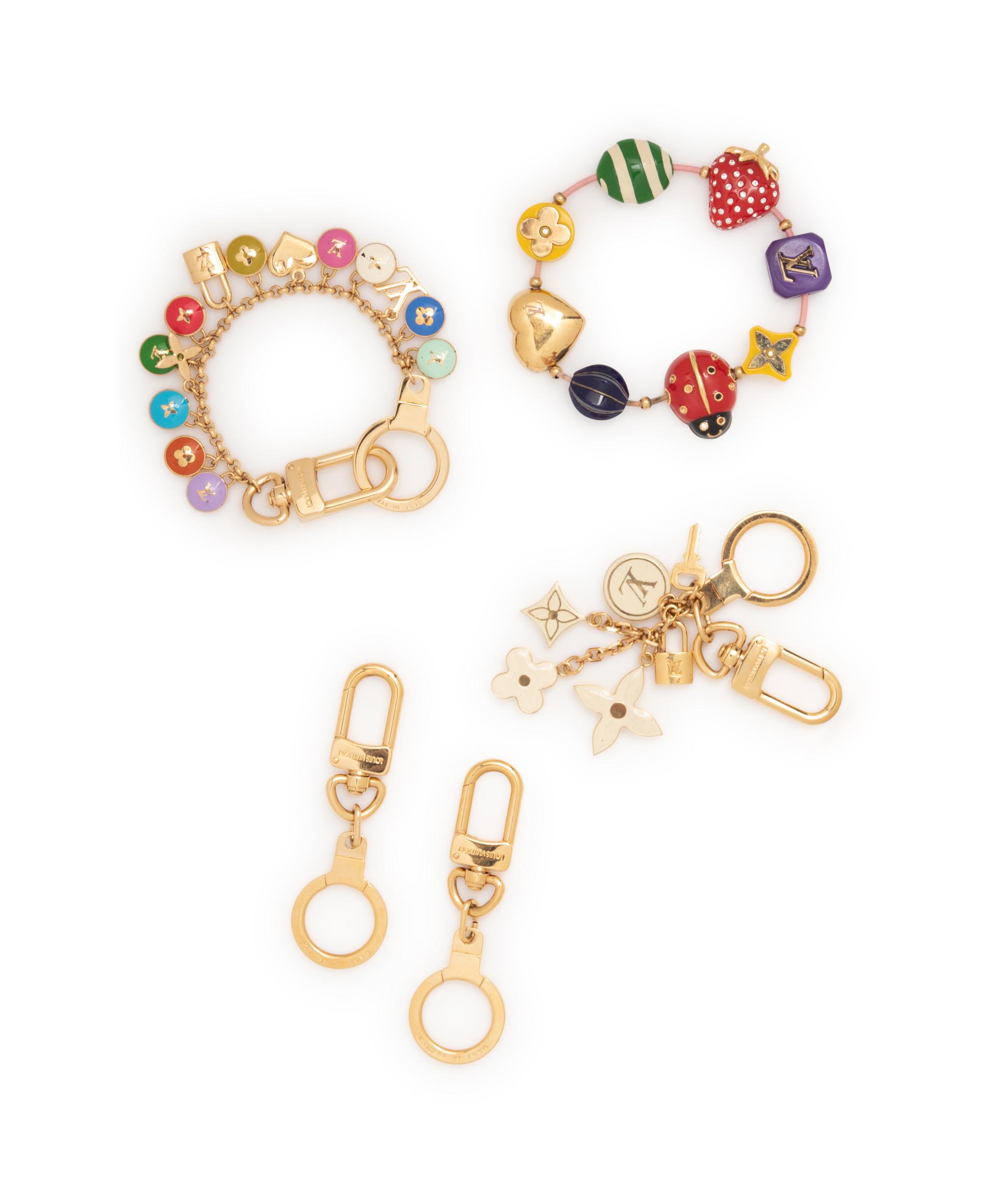 Five Louis Vuitton pieces, 2000-10s: One Bracelet & Four Purse/Key Chains