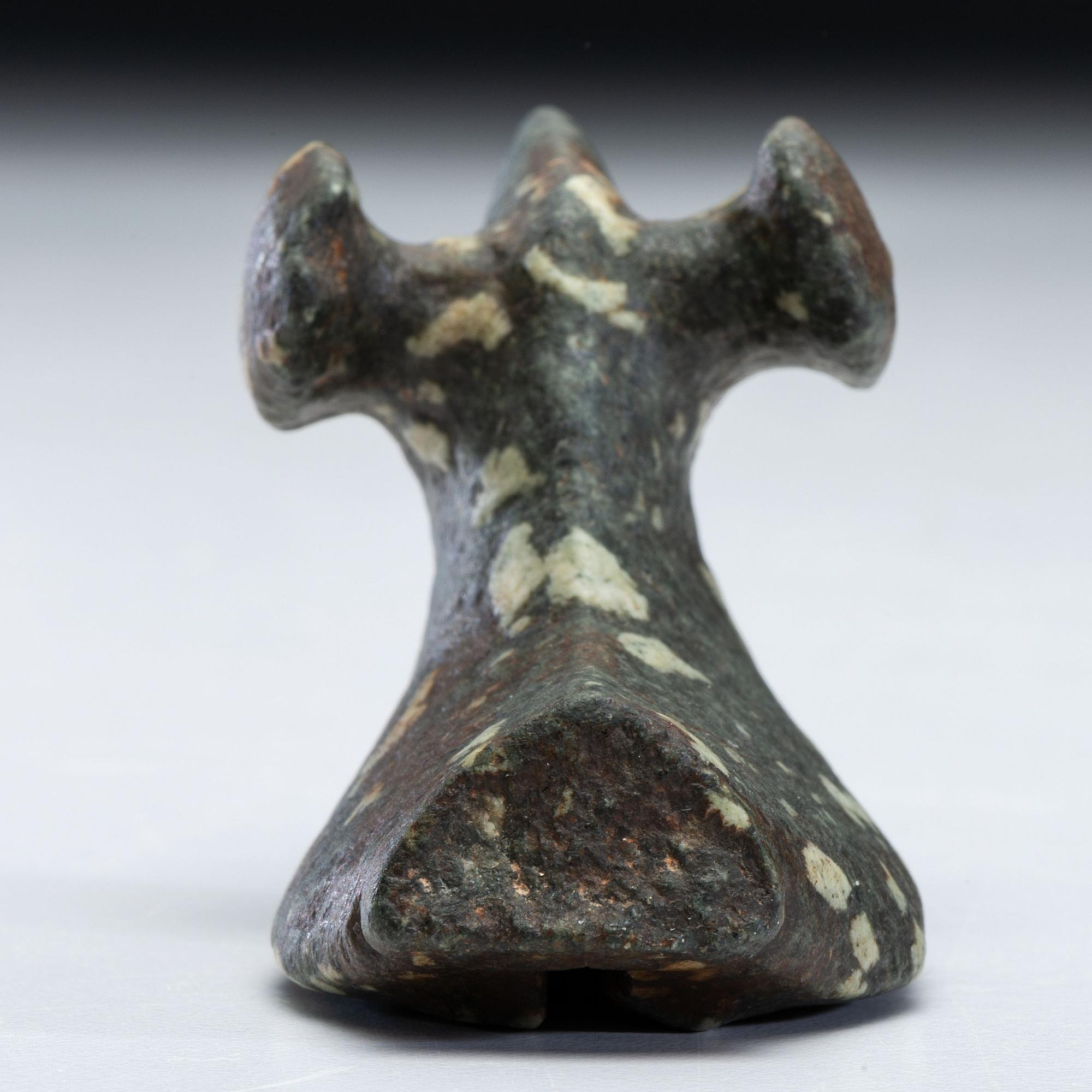 A Salvaged Porphyry Popeye Birdstone, with Red Ocher