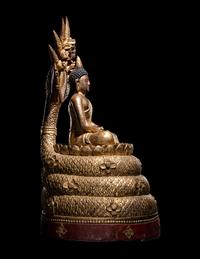 A Large Thait Gilt and Red Lacquered Wood Figure of Buddha