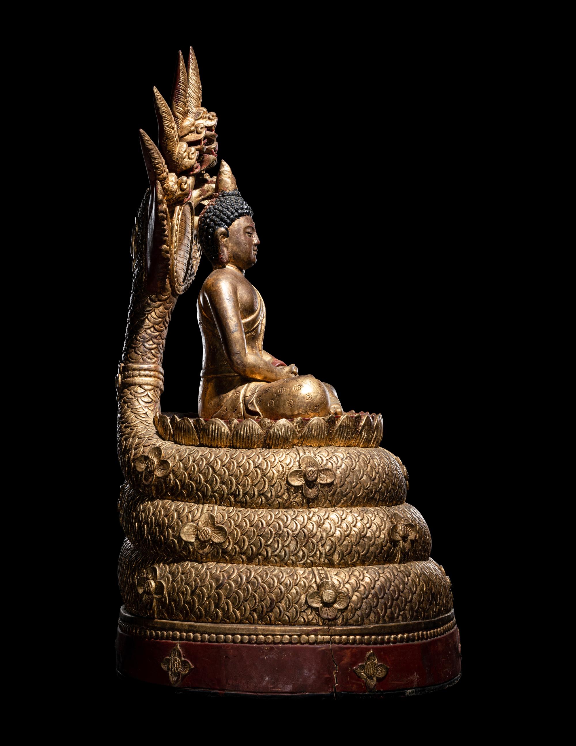 A Large Thait Gilt and Red Lacquered Wood Figure of Buddha