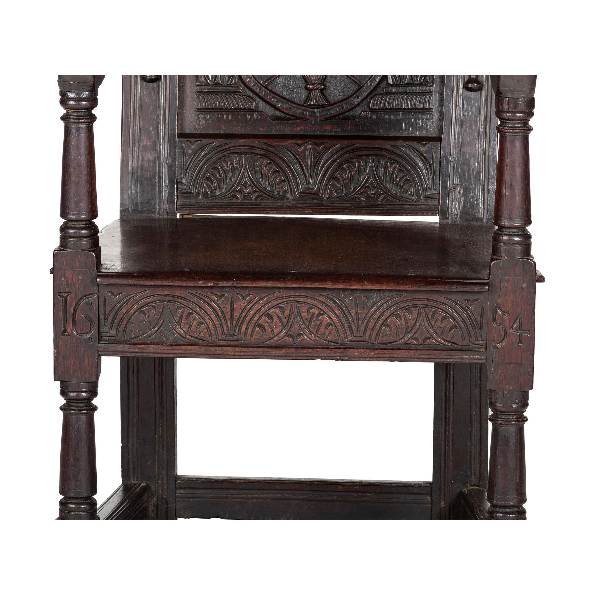 An English Carved Oak and Elm Panel-Back Armchair
