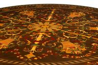 A Continental Polychrome Marquetry and Parcel Gilt Center Table