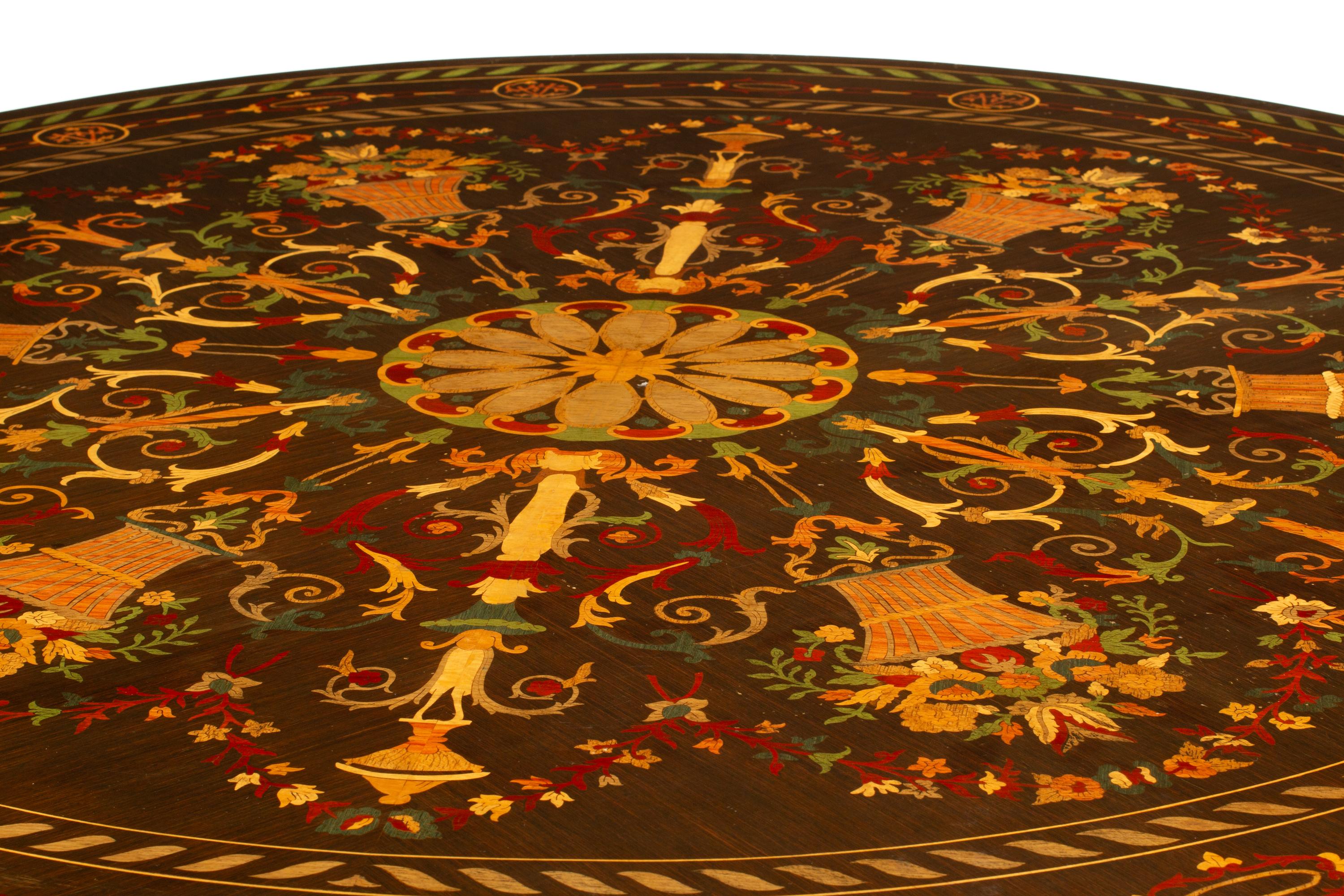 A Continental Polychrome Marquetry and Parcel Gilt Center Table