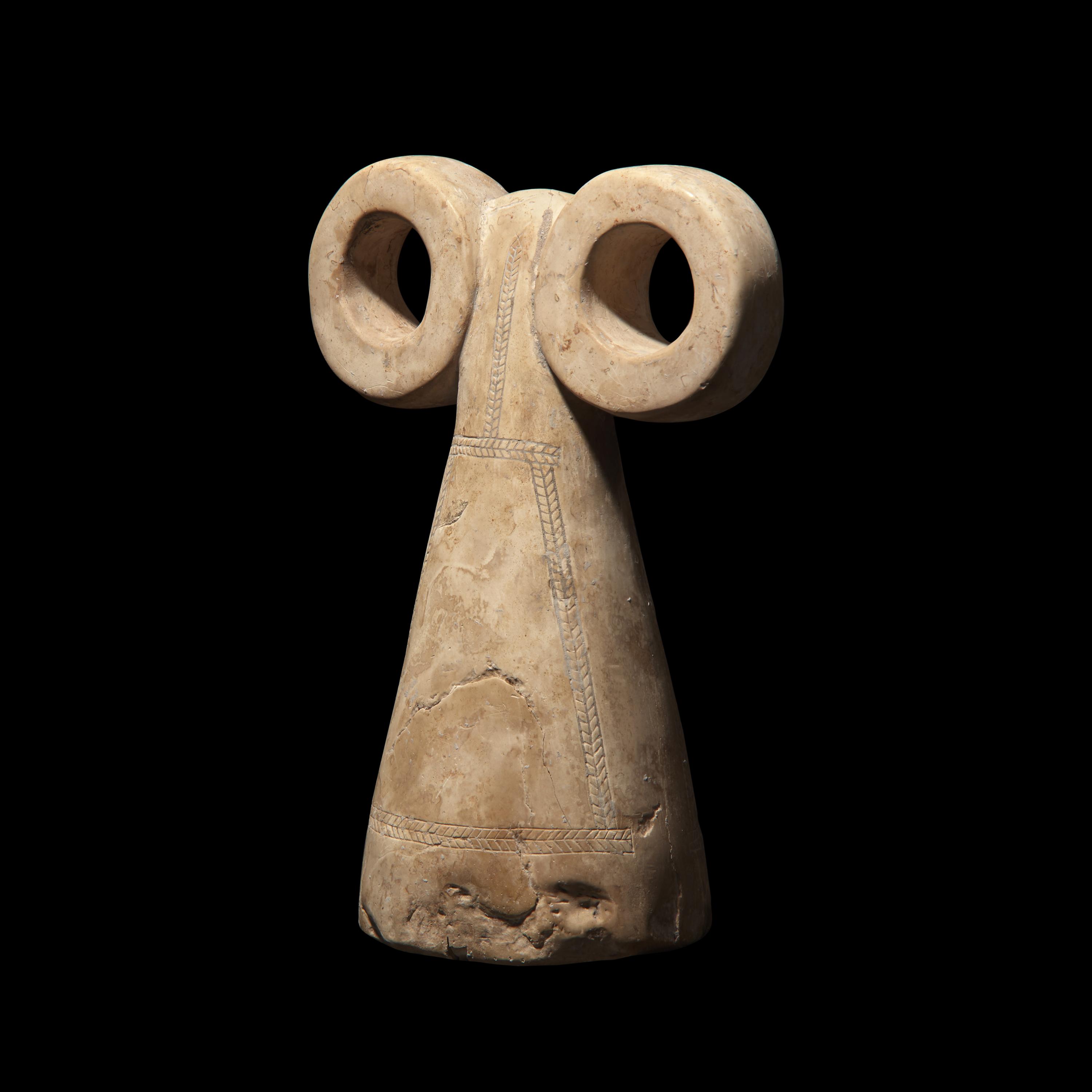 A Mesopotamian Stone Spectacle Idol