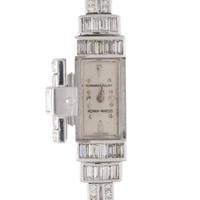 AUDEMARS PIGUET, PLATINUM AND DIAMOND SURPRISE WRISTWATCH