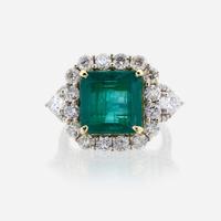 An emerald, diamond, and eighteen karat white gold ring