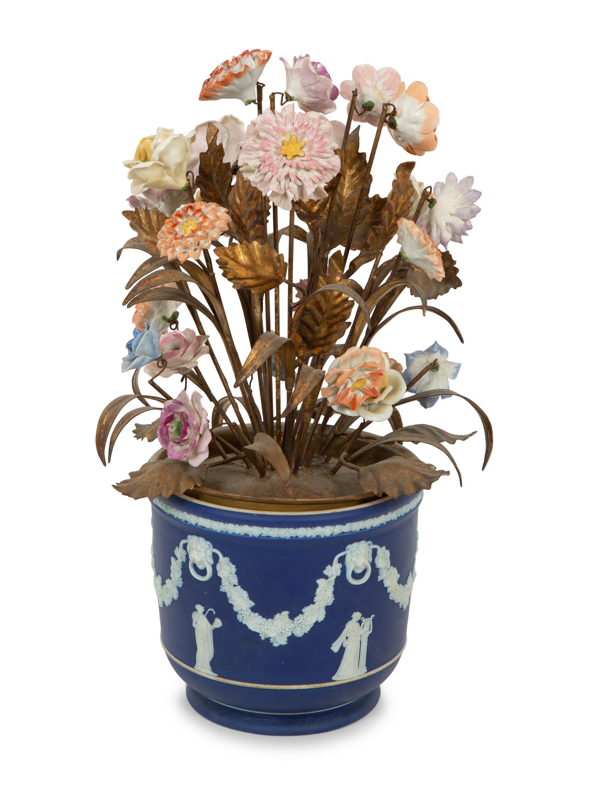 A Wedgwood Jasperware Cache Pot with a Tole and Porcelain Flower Arrangement