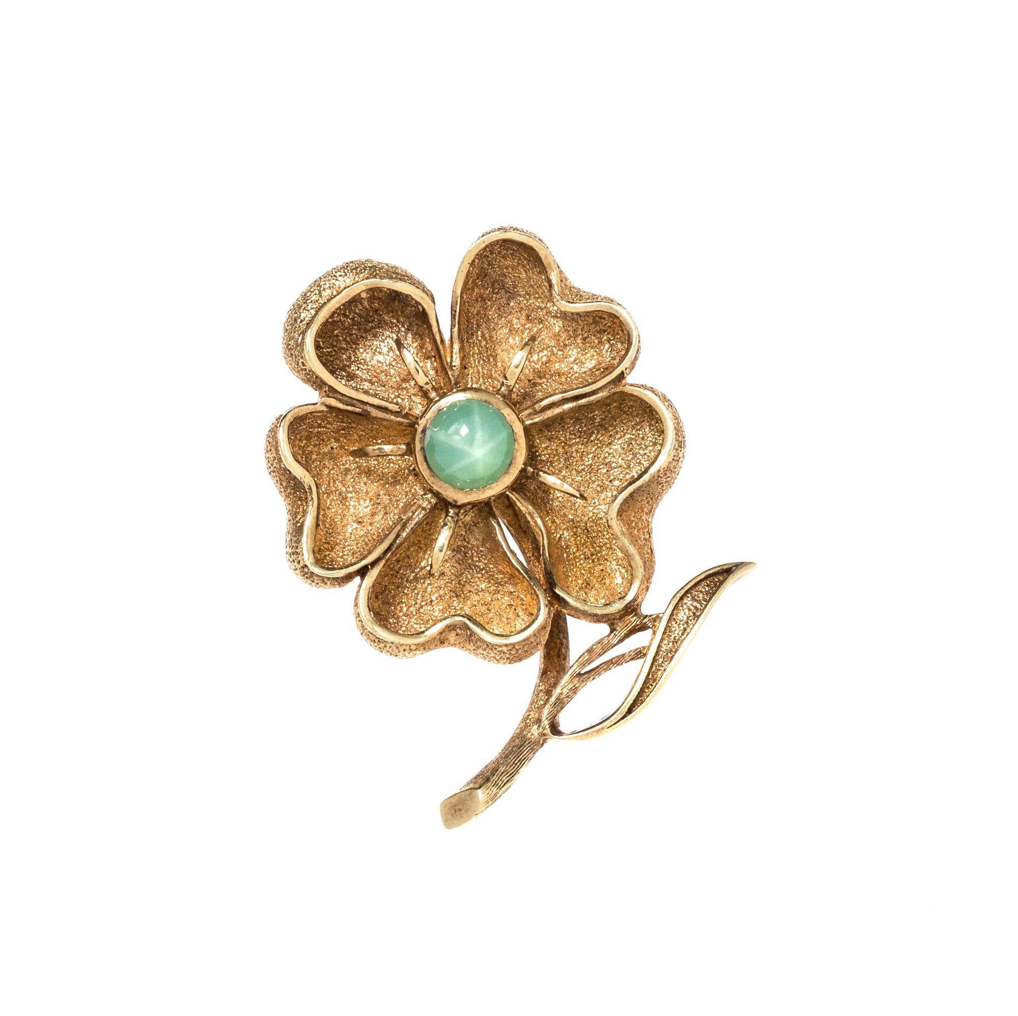 YELLOW GOLD AND SYNTHETIC GREEN STAR SAPPHIRE FLOWER BROOCH