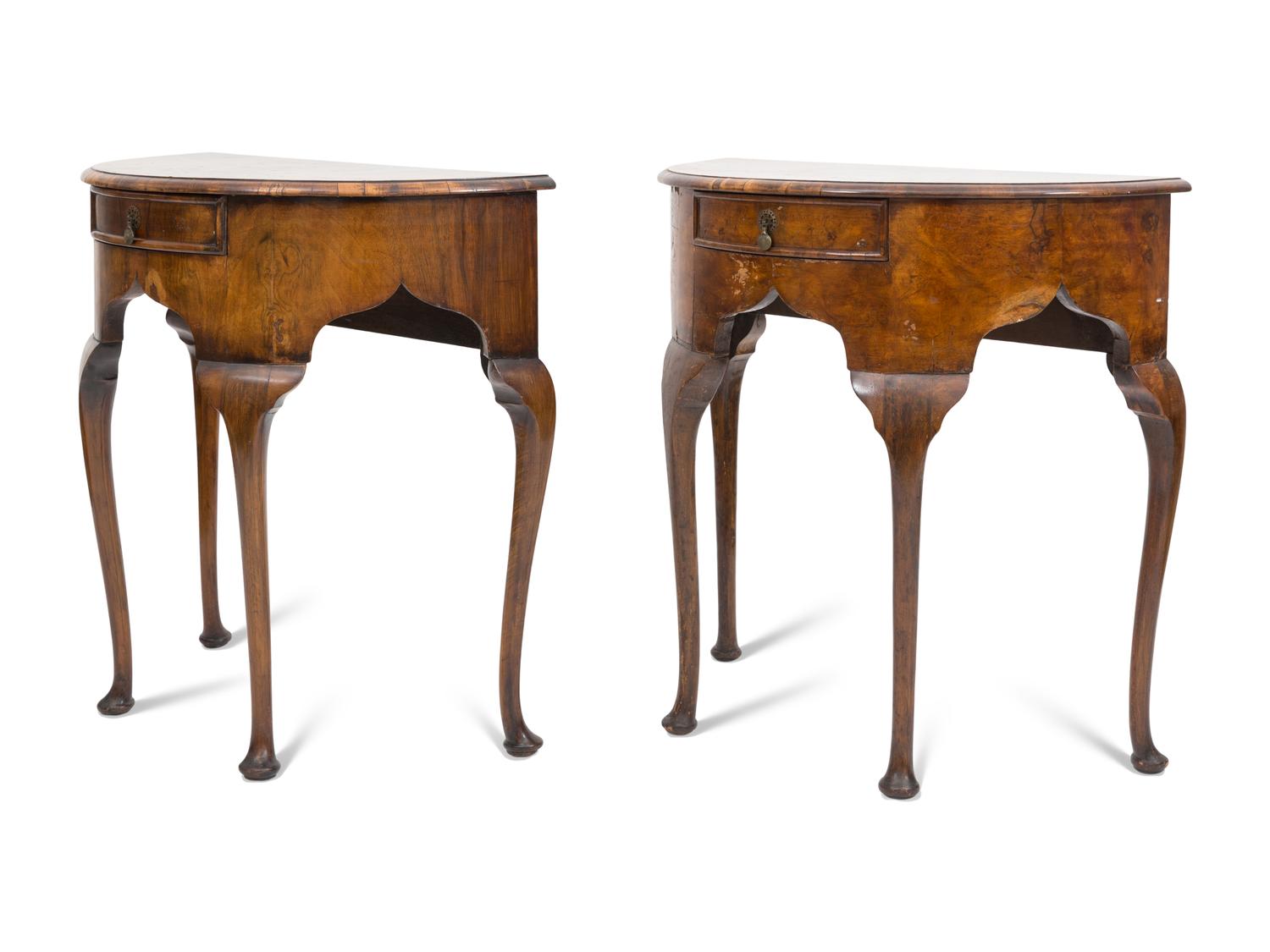 A Pair of Georgian Style Burl Walnut Demilune Console Tables