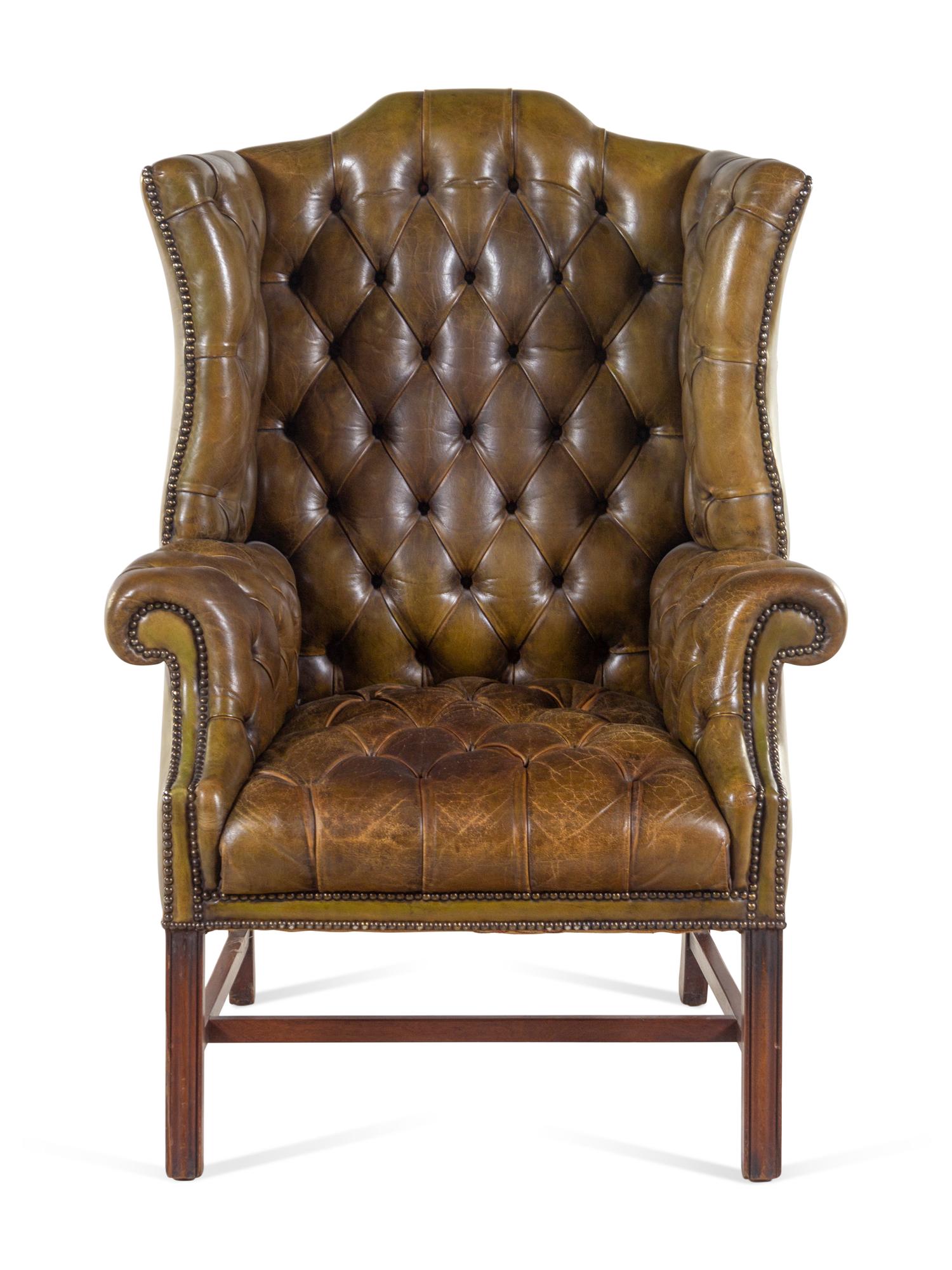 An English Leather Upholstered Mahogany Wingback Armchair