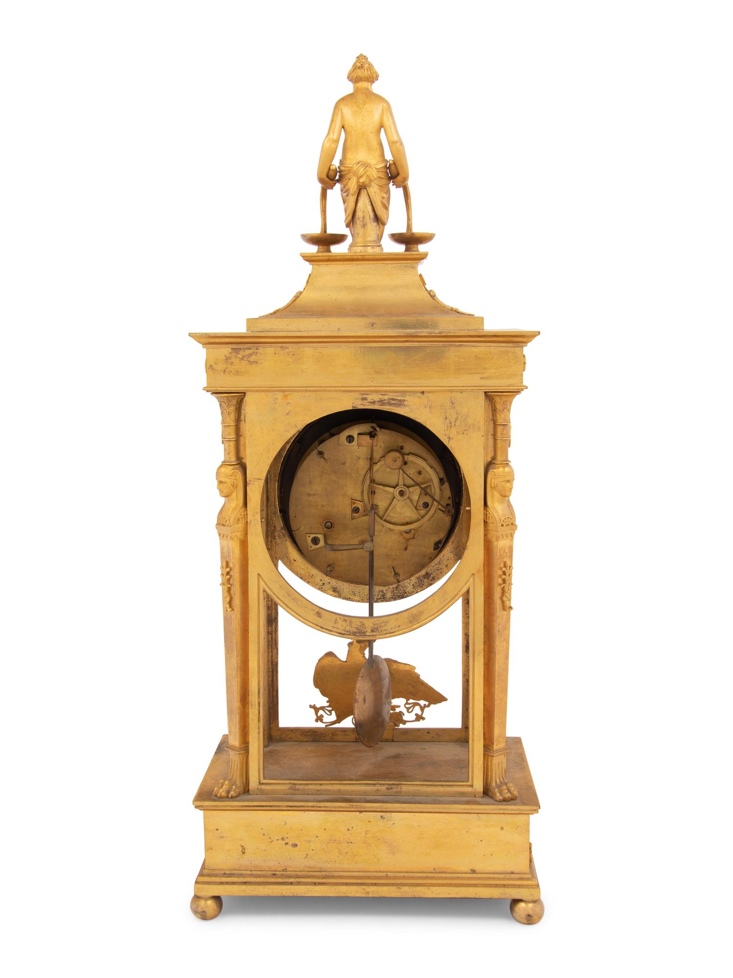 An Empire Gilt Bronze Figural Mantel Clock