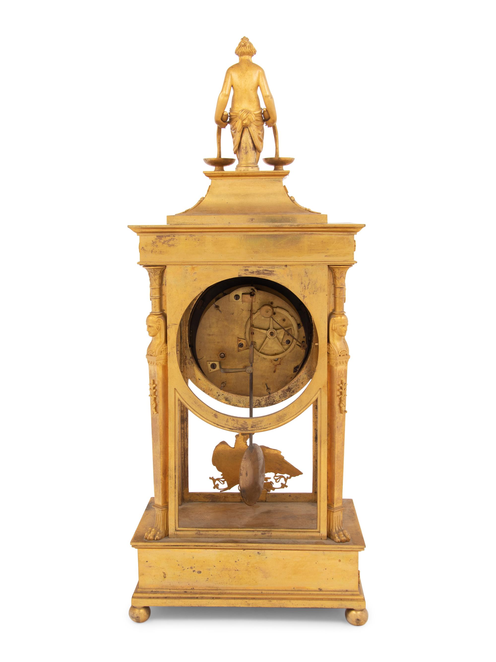An Empire Gilt Bronze Figural Mantel Clock
