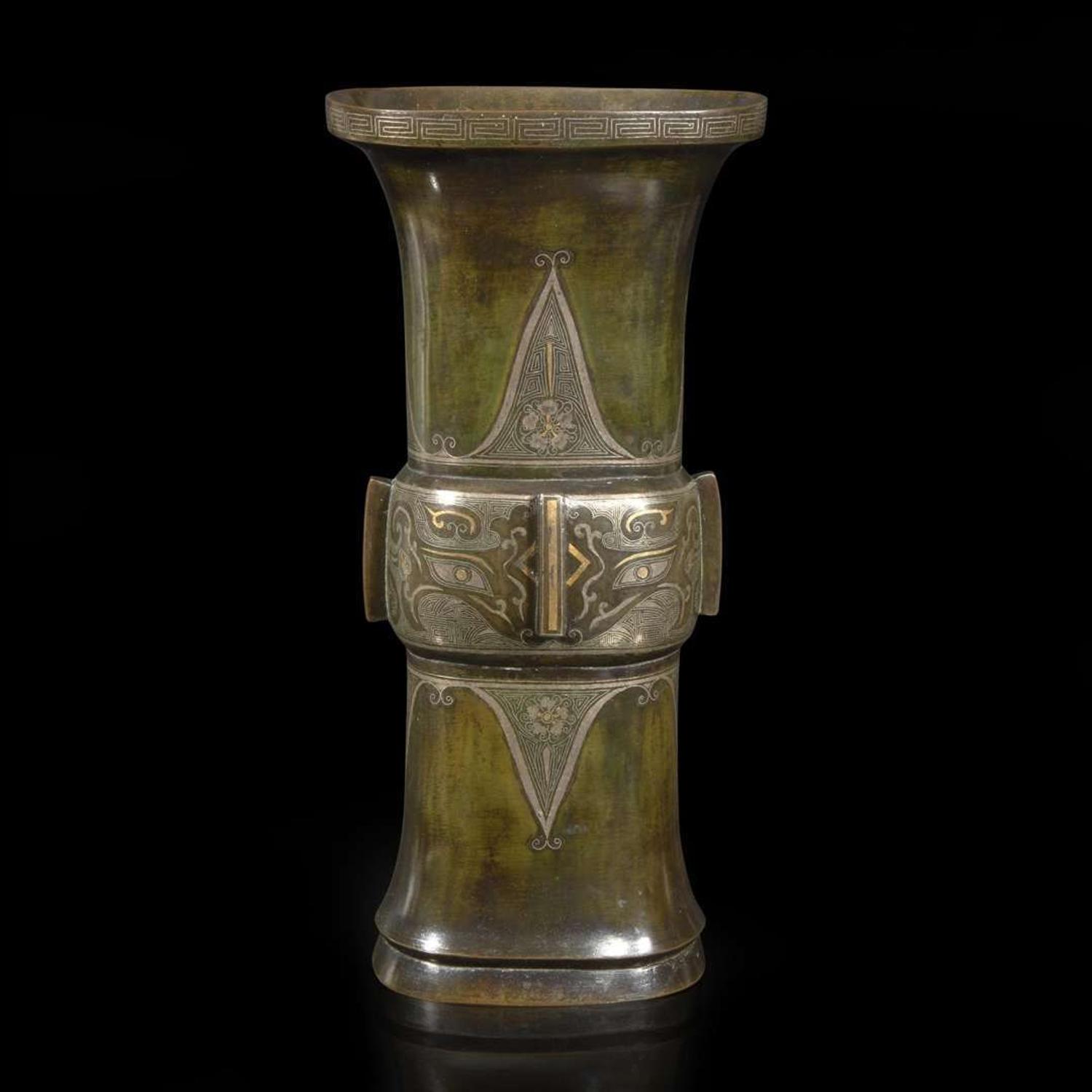 A gold and silver-inlaid and patinated bronze archaistic gu-form vase 金银象嵌加漆觚