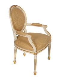 A Set of Eight Louis XVI Style Painted and Parcel Gilt Fauteuils