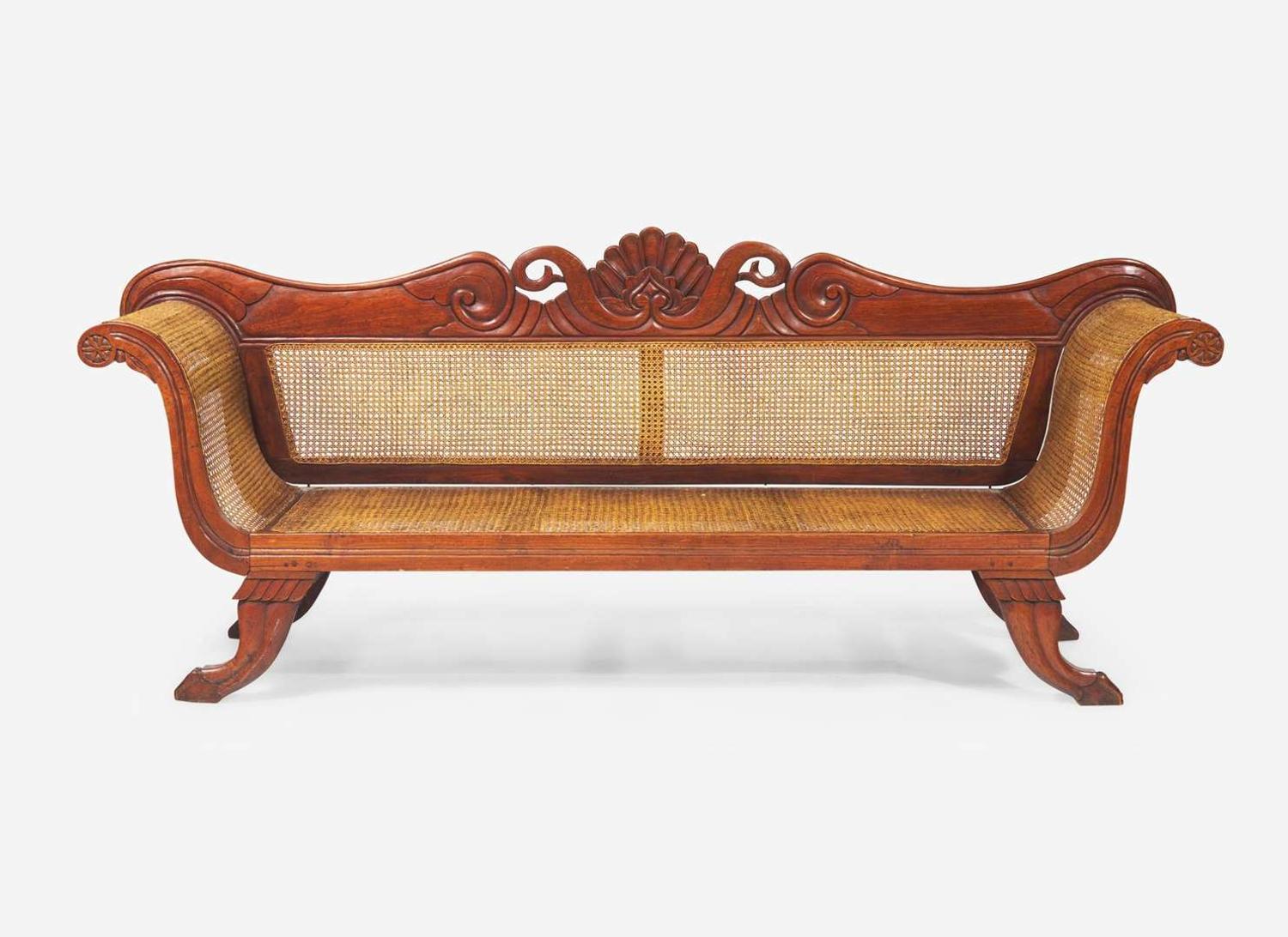 An Anglo-Colonial carved hardwood and caned sofa, first half 19th century