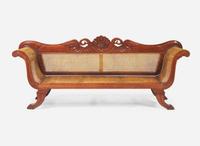 An Anglo-Colonial carved hardwood and caned sofa, first half 19th century