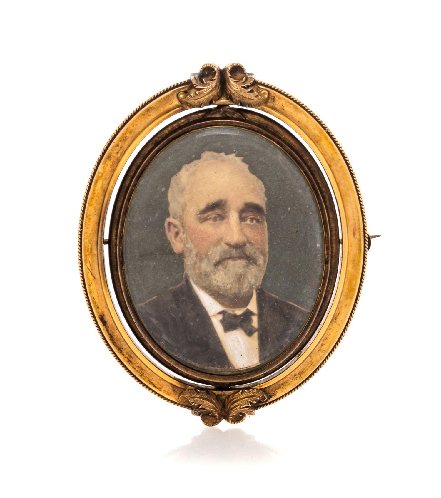 A Victorian Gilt Metal Portrait Brooch Height 2 7/8 inches.