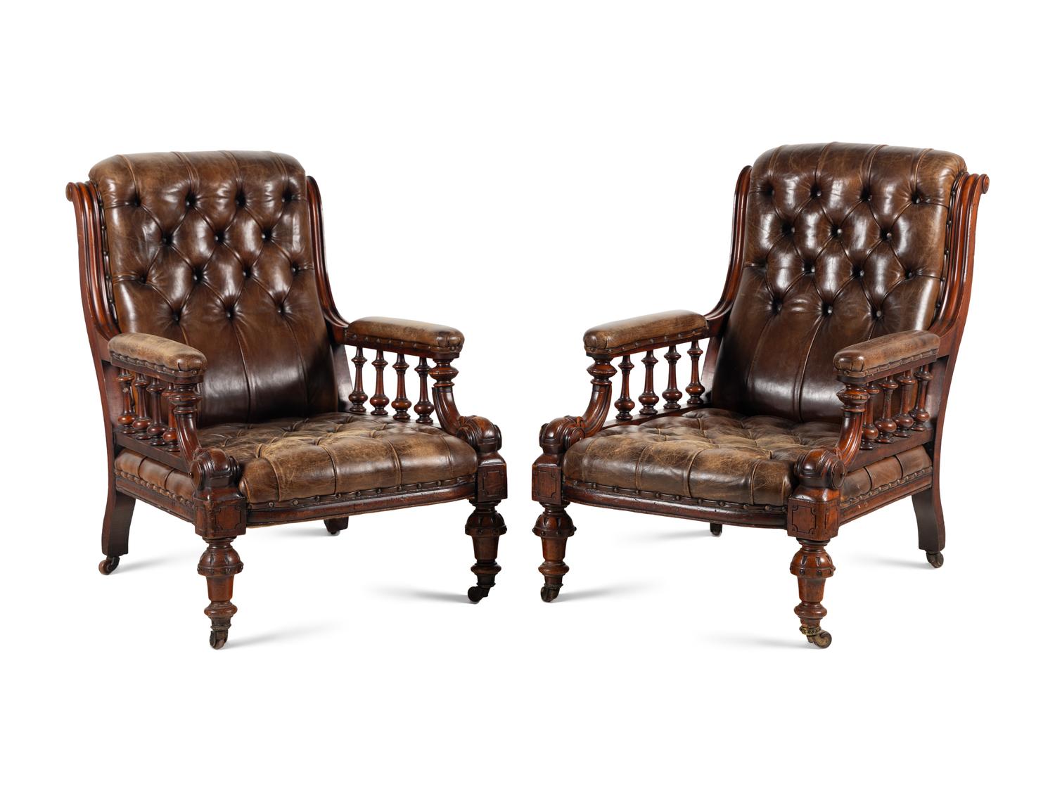 A Pair of English Carved Mahogany Buttoned Leather Armchairs