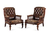 A Pair of English Carved Mahogany Buttoned Leather Armchairs