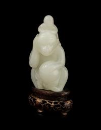 A White Jade 'Monkeys' Carving