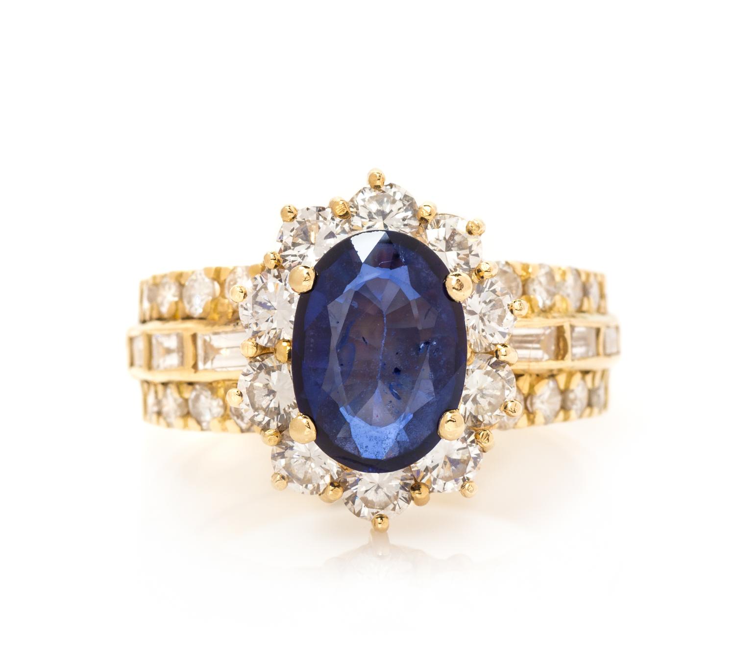 An 18 Karat Yellow Gold, Sapphire and Diamond Ring, 6.10 dwts.