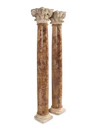 A Pair of Carved Limestone Capitals with Breccia Marble Columns