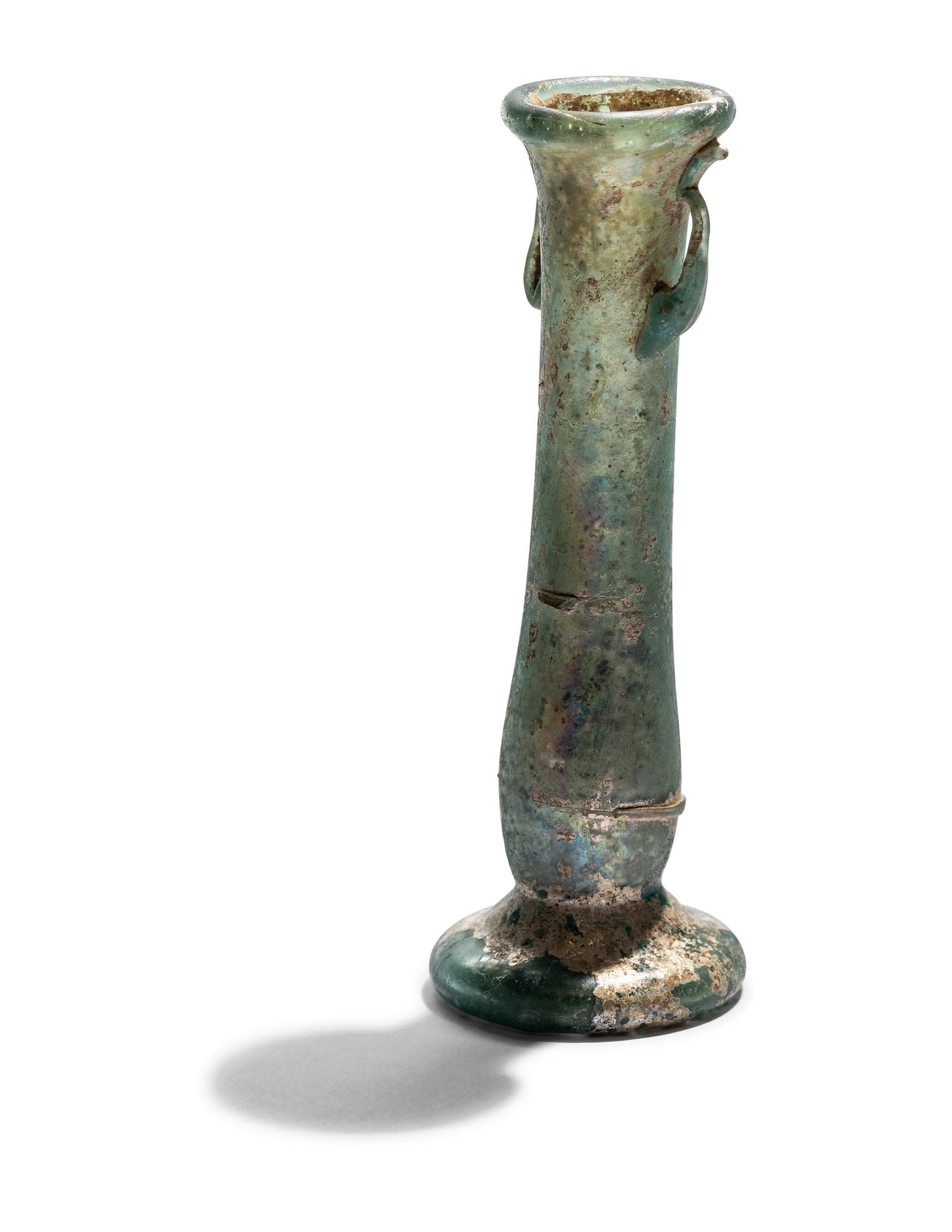 A Roman Blue Glass Unguentarium