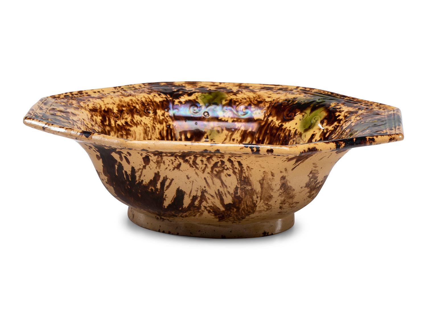 A Large Molded Yellowware Bowl with Flint Enamel Glaze