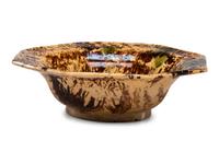 A Large Molded Yellowware Bowl with Flint Enamel Glaze