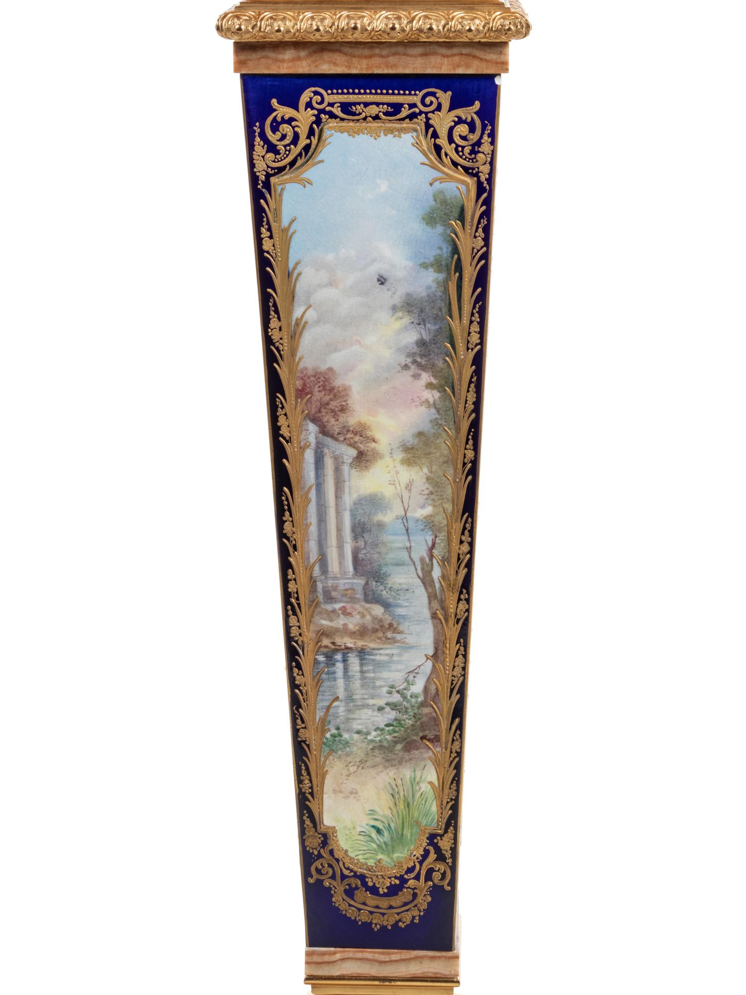 A Pair of Sèvres Style Gilt Bronze Mounted Painted and Parcel Gilt Porcelain and Onyx Pedestals