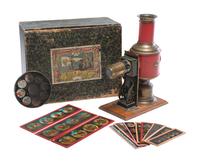 [EARLY PHOTOGRAPHY]. Magic Lantern projector in original box with slides.
