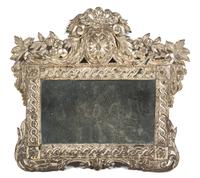 A Continental Stamped Silvered Metal Mirror Height 15 1/2 x width 15 1/2 inches. — 19TH CENTURY