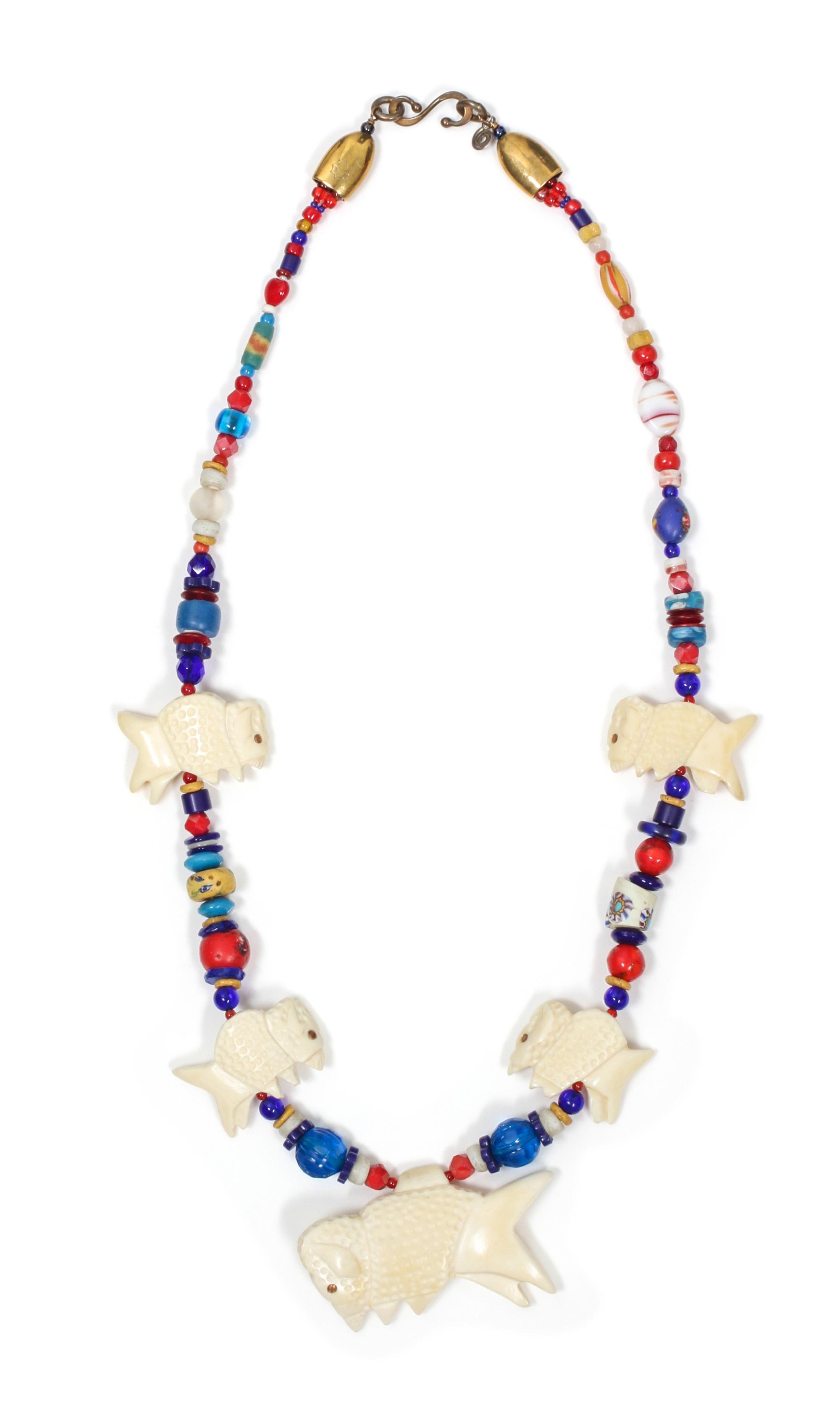A Buffalo Fetish Necklace, Robert Kaniatobe (1936-1998) Length of the first 26 inches.