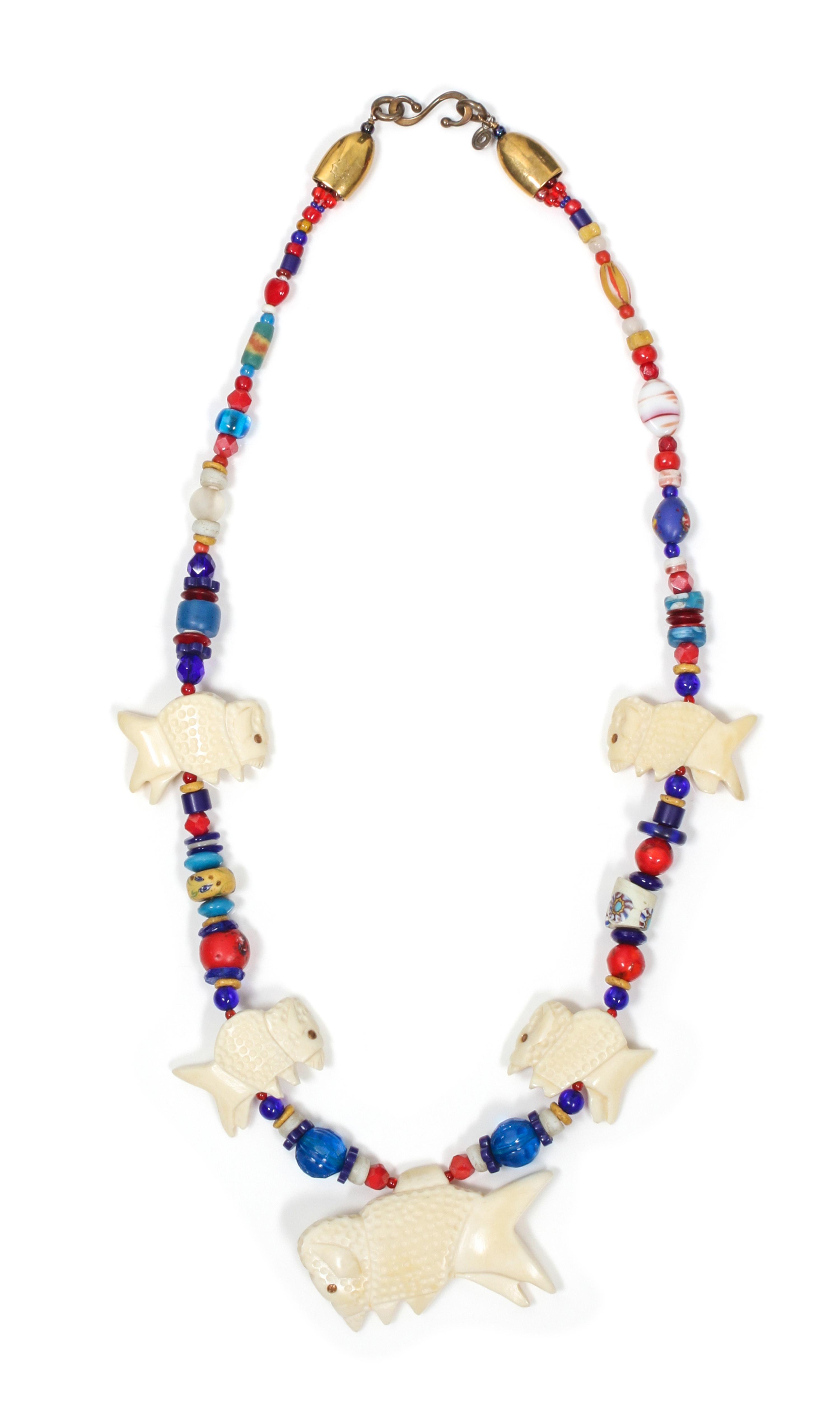 A Buffalo Fetish Necklace, Robert Kaniatobe (1936-1998) Length of the first 26 inches.