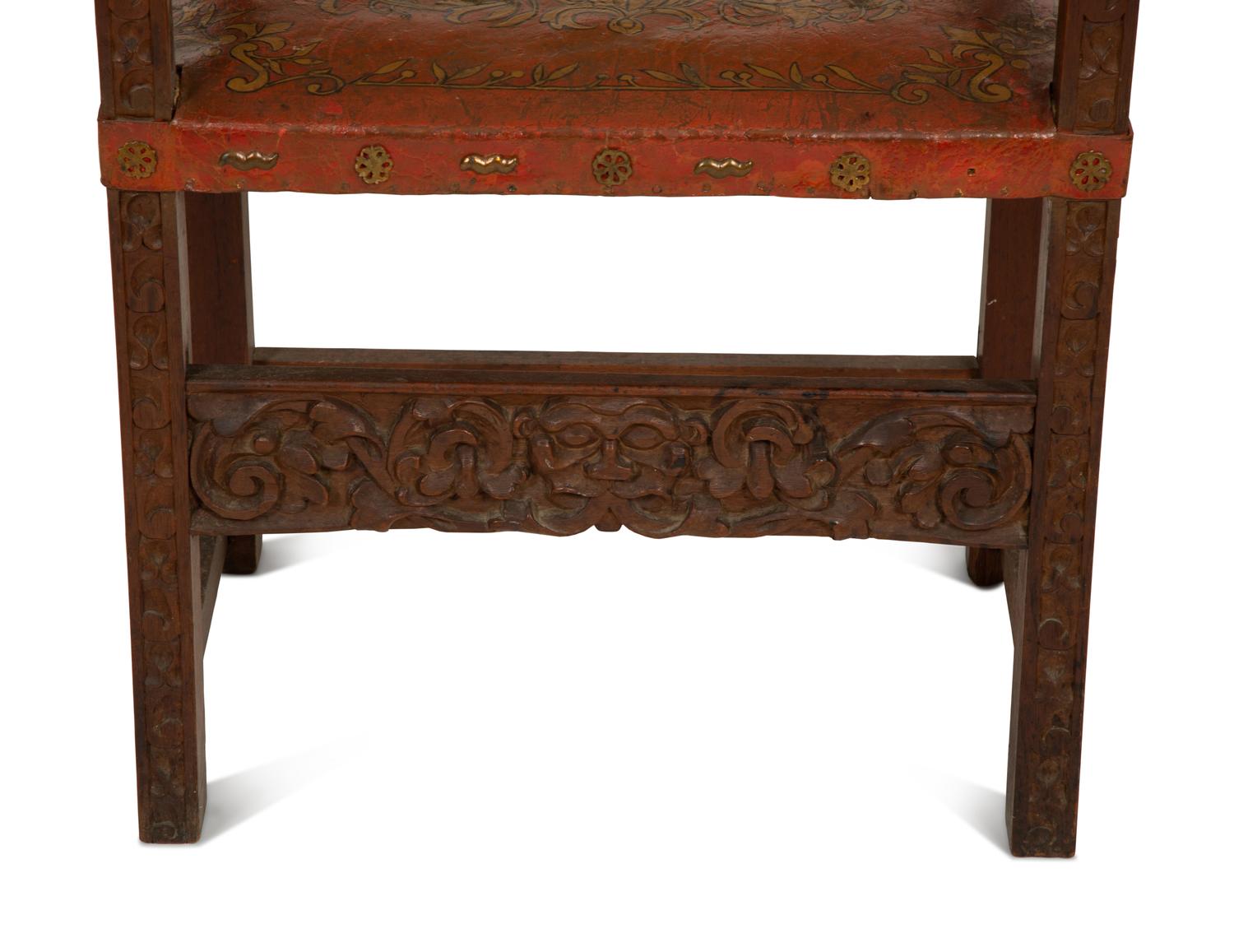 An Italian Baroque Style Carved Oak Open Armchair with Painted Leather Back and Seat