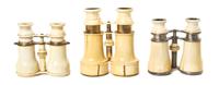Three Pairs of French Ivory Veneered Opera Glasses, Width of widest 5 inches.