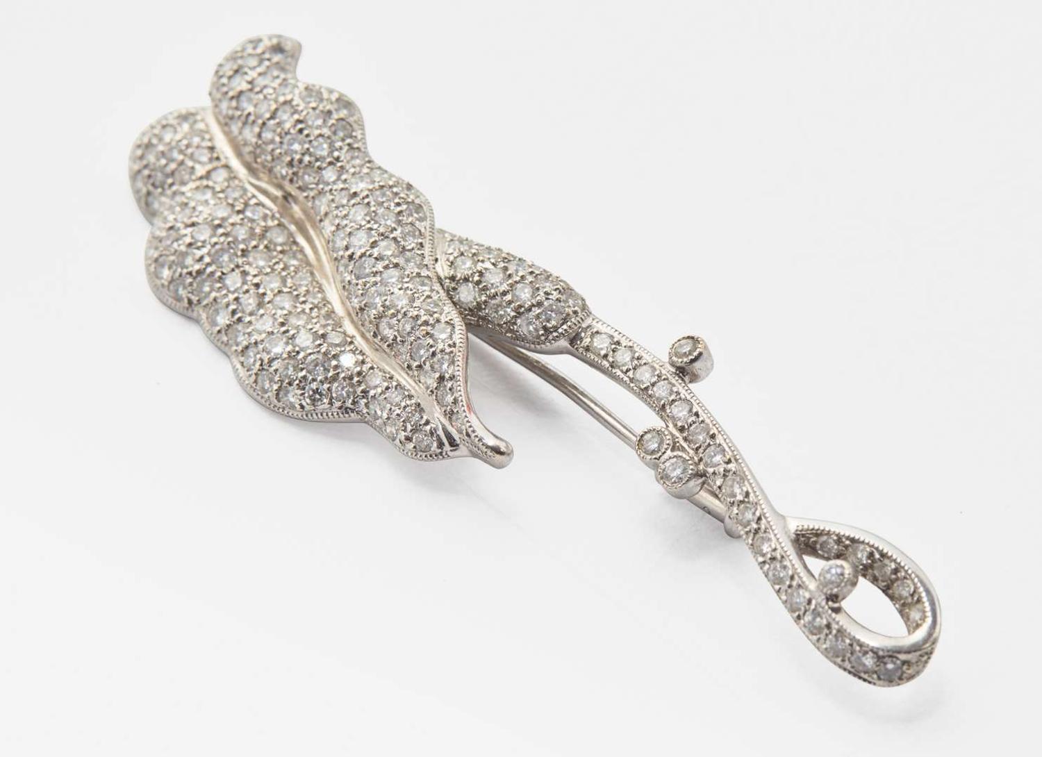 A Platinum and Diamond Flower Brooch
