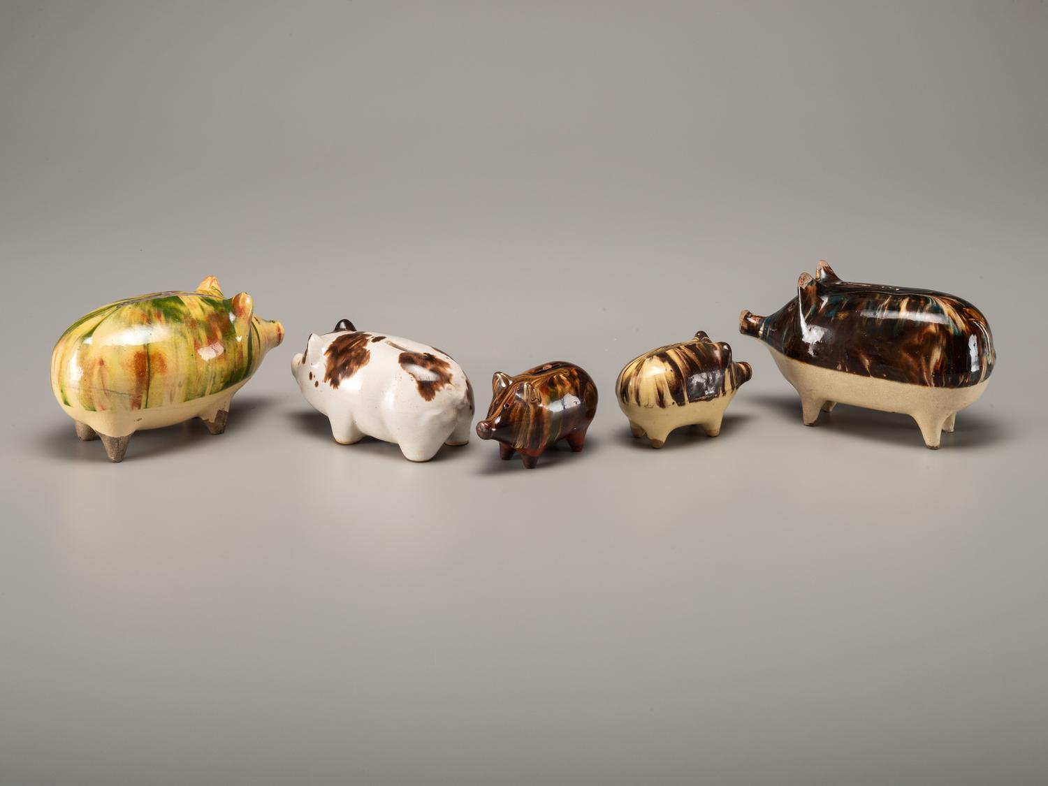 Fifteen Rockingham Glaze Mugs and Pig Banks